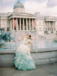 A stylish model wears a breathtaking ombré dress with voluminous ruffles